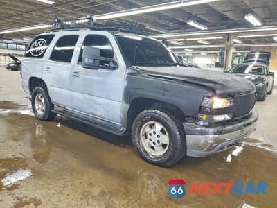 Czwarte zdjęcie samochodu z boku: 2001 CHEVROLET TAHOE K1500 VIN:1GNEK13T51J261218 - miniatura