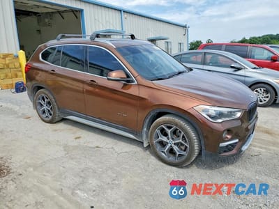 Czwarte zdjęcie samochodu z boku: 2016 BMW X1 XDRIVE28I VIN:WBXHT3C37GP880247 - miniatura