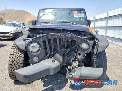 Piąte zdjęcie samochodu w środku: 2017 JEEP WRANGLER UNLIMITED SAHARA VIN:1C4BJWEG0HL701744 - miniatura