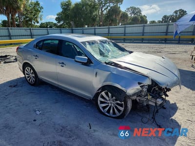 Czwarte zdjęcie samochodu z boku: 2013 LINCOLN MKS VIN:1LNHL9DK4DG613130 - miniatura