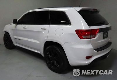 Czwarte zdjęcie samochodu z boku: 2013 JEEP GRAND CHEROKEE SRT-8 VIN:1C4RJFDJ4DC563714 - miniatura