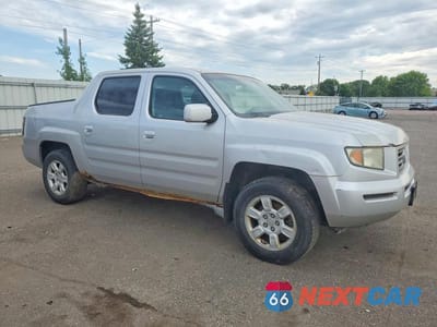 Czwarte zdjęcie samochodu z boku: 2006 HONDA RIDGELINE RTS VIN:2HJYK16416H571994 - miniatura
