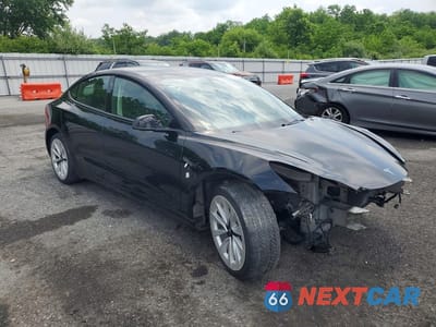 Czwarte zdjęcie samochodu z boku: 2022 TESLA MODEL 3 VIN:5YJ3E1EA4NF289558 - miniatura