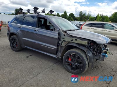 Czwarte zdjęcie samochodu z boku: 2014 JEEP GRAND CHEROKEE SRT-8 VIN:1C4RJFDJ6EC446900 - miniatura