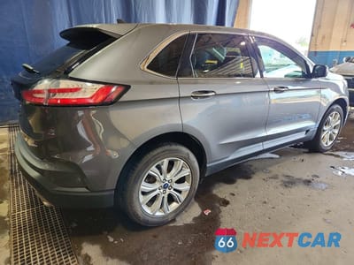 Trzecie zdjęcie samochodu z tyłu: 2022 FORD EDGE TITANIUM VIN:2FMPK4K93NBA14083 - miniatura