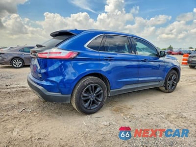 Trzecie zdjęcie samochodu z tyłu: 2020 FORD EDGE SEL VIN:2FMPK3J98LBA10796 - miniatura