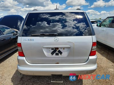 Zdjęcie 6 z 12 samochodu: 2001 MERCEDES-BENZ ML 430 VIN:4JGAB72E21A280348 - miniatura