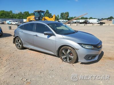 Czwarte zdjęcie samochodu z boku: 2016 HONDA CIVIC TOURING VIN:2HGFC1F97GH649976 - miniatura