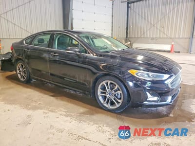 Czwarte zdjęcie samochodu z boku: 2020 FORD FUSION TITANIUM VIN:3FA6P0RU6LR139541 - miniatura