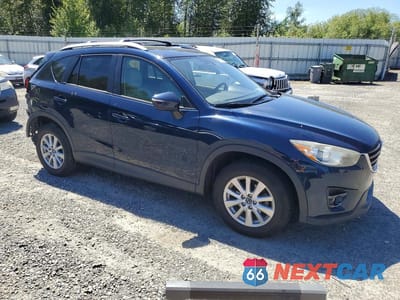 Czwarte zdjęcie samochodu z boku: 2016 MAZDA CX-5 TOURING VIN:JM3KE4CY7G0921006 - miniatura