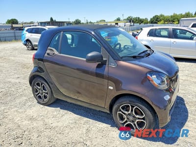 Czwarte zdjęcie samochodu z boku: 2018 SMART FORTWO VIN:WMEFJ9BA2JK308828 - miniatura