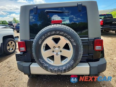 Zdjęcie 6 z 13 samochodu: 2010 JEEP WRANGLER UNLIMITED SAHARA VIN:1J4BA5H18AL205639 - miniatura