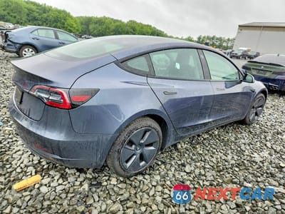 Trzecie zdjęcie samochodu z tyłu: 2023 TESLA MODEL 3 VIN:5YJ3E1EA0PF405924 - miniatura