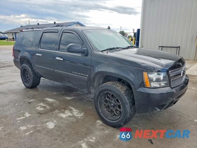 Czwarte zdjęcie samochodu z boku: 2007 CHEVROLET SUBURBAN K1500 VIN:1GNFK16307J348405 - miniatura