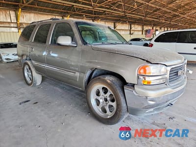 Czwarte zdjęcie samochodu z boku: 2002 GMC YUKON VIN:1GKEC13T22R132849 - miniatura
