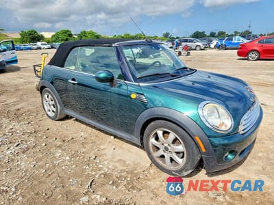Czwarte zdjęcie samochodu z boku: 2009 MINI COOPER VIN:WMWMR33599TU96070 - miniatura