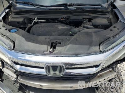 Zdjęcie 12 z 14 samochodu: 2019 HONDA PILOT TOURING VIN:5FNYF5H91KB033272 - miniatura
