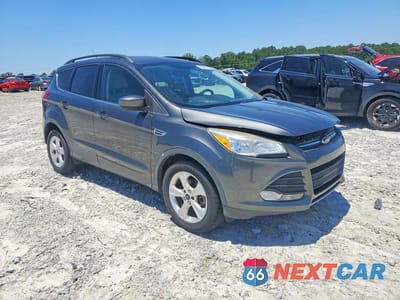 Czwarte zdjęcie samochodu z boku: 2015 FORD ESCAPE SE VIN:1FMCU0G96FUB10697 - miniatura