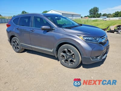 Czwarte zdjęcie samochodu z boku: 2018 HONDA CR-V TOURING VIN:7FARW2H90JE099124 - miniatura