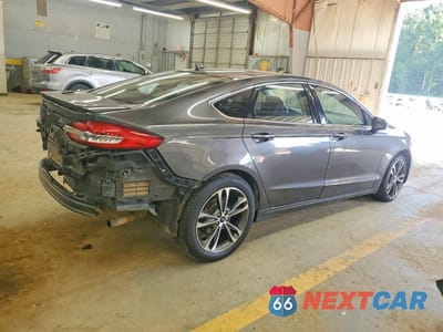 Trzecie zdjęcie samochodu z tyłu: 2020 FORD FUSION TITANIUM VIN:3FA6P0D99LR136619 - miniatura