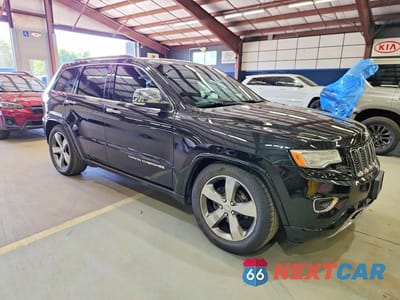 Czwarte zdjęcie samochodu z boku: 2015 JEEP GRAND CHEROKEE OVERLAND VIN:1C4RJFCG8FC859876 - miniatura