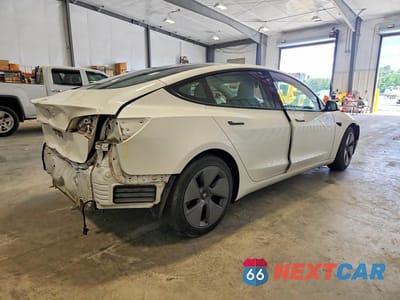 Trzecie zdjęcie samochodu z tyłu: 2021 TESLA MODEL 3 VIN:5YJ3E1EA7MF027306 - miniatura