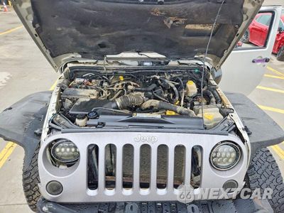 Zdjęcie 12 z 13 samochodu: 2011 JEEP WRANGLER SAHARA VIN:1J4AA5D10BL503251 - miniatura