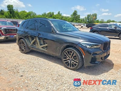 Czwarte zdjęcie samochodu z boku: 2022 BMW X5 M50I VIN:5UXJU4C08N9L44625 - miniatura