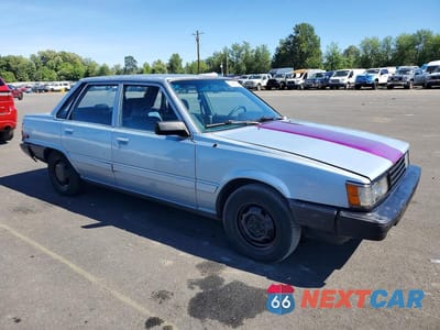 Czwarte zdjęcie samochodu z boku: 1986 TOYOTA CAMRY DLX VIN:JT2SV12E0G6025439 - miniatura