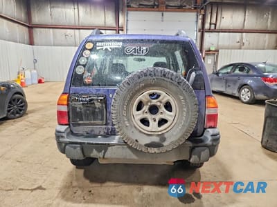 Zdjęcie 6 z 13 samochodu: 1999 CHEVROLET TRACKER VIN:2CNBJ13C0X6932410 - miniatura