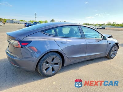 Trzecie zdjęcie samochodu z tyłu: 2023 TESLA MODEL 3 VIN:5YJ3E1EA6PF639419 - miniatura