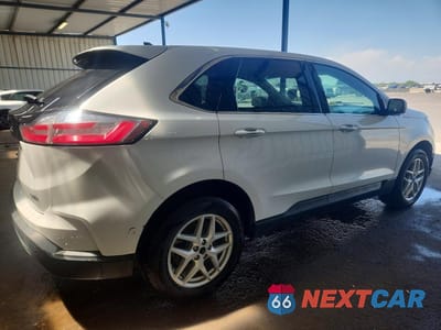 Trzecie zdjęcie samochodu z tyłu: 2022 FORD EDGE SEL VIN:2FMPK4J92NBA44905 - miniatura