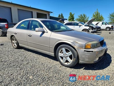 Czwarte zdjęcie samochodu z boku: 2000 LINCOLN LS VIN:1LNHM87A0YY904864 - miniatura