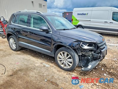 Czwarte zdjęcie samochodu z boku: 2014 VOLKSWAGEN TIGUAN S VIN:WVGBV3AX1EW541890 - miniatura
