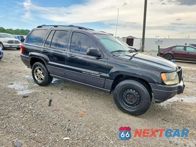 Czwarte zdjęcie samochodu z boku: 2003 JEEP GRAND CHEROKEE LAREDO VIN:1J4GW48S83C608856 - miniatura