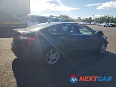 Trzecie zdjęcie samochodu z tyłu: 2016 FORD FUSION TITANIUM PHEV VIN:3FA6P0SU4GR320511 - miniatura