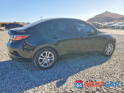 Trzecie zdjęcie samochodu z tyłu: 2016 SCION IA BASE VIN:3MYDLBZV0GY143387 - miniatura