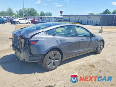 Trzecie zdjęcie samochodu z tyłu: 2023 TESLA MODEL 3 VIN:5YJ3E1EAXPF669166 - miniatura