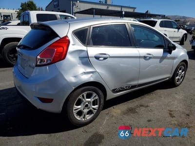 Trzecie zdjęcie samochodu z tyłu: 2014 FORD FIESTA SE VIN:3FADP4EJ3EM203769 - miniatura