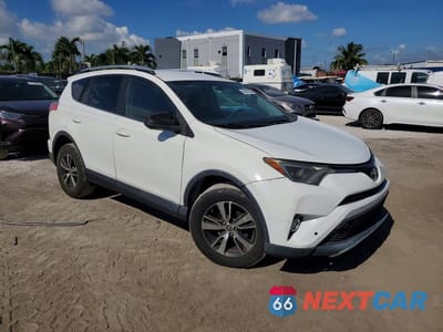 Czwarte zdjęcie samochodu z boku: 2016 TOYOTA RAV4 LE VIN:2T3BFREV0GW411694 - miniatura