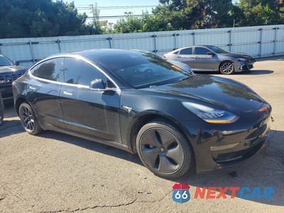 Czwarte zdjęcie samochodu z boku: 2019 TESLA MODEL 3 VIN:5YJ3E1EA2KF297623 - miniatura