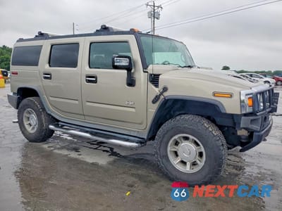 Czwarte zdjęcie samochodu z boku: 2005 HUMMER H2 VIN:5GRGN23U45H101995 - miniatura