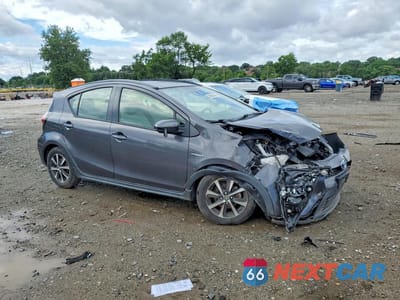 Czwarte zdjęcie samochodu z boku: 2018 TOYOTA PRIUS C ONE VIN:JTDKDTB36J1602998 - miniatura