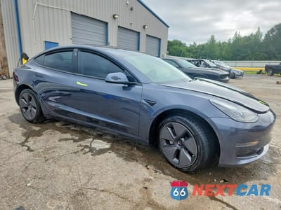 Czwarte zdjęcie samochodu z boku: 2021 TESLA MODEL 3 VIN:5YJ3E1EA0MF906131 - miniatura