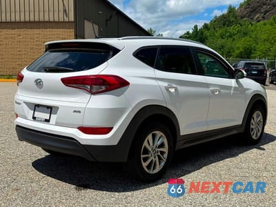 Czwarte zdjęcie samochodu z boku: 2016 HYUNDAI TUCSON SE VIN:KM8J3CA47GU184124 - miniatura