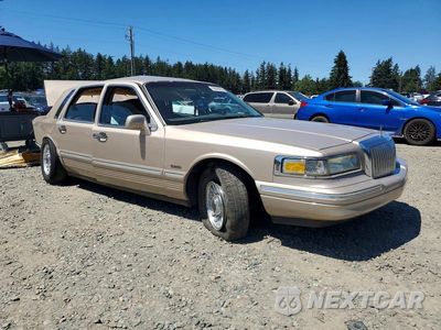 Czwarte zdjęcie samochodu z boku: 1997 LINCOLN TOWN CAR EXECUTIVE VIN:1LNLM81W1VY605328 - miniatura