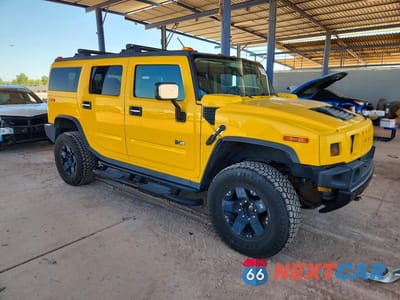 Czwarte zdjęcie samochodu z boku: 2003 HUMMER H2 VIN:5GRGN23U03H132738 - miniatura