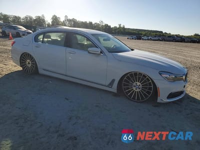 Czwarte zdjęcie samochodu z boku: 2016 BMW 740 I VIN:WBA7E2C57GGD99896 - miniatura