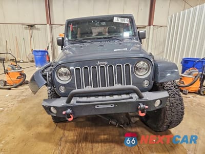 Piąte zdjęcie samochodu w środku: 2016 JEEP WRANGLER UNLIMITED SAHARA VIN:1C4BJWEG9GL239716 - miniatura