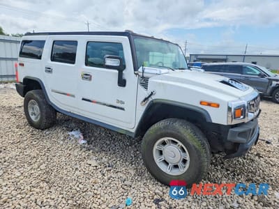 Czwarte zdjęcie samochodu z boku: 2004 HUMMER H2 VIN:5GRGN23U74H122421 - miniatura
